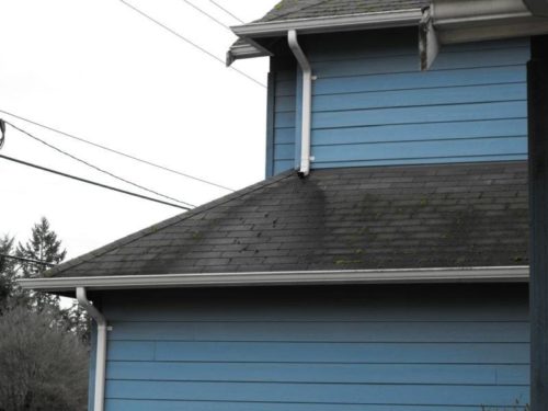 Downspout draining onto roof