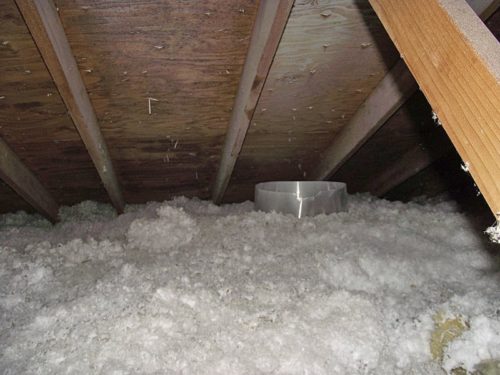 The insulation baffle around the light visible in the attic